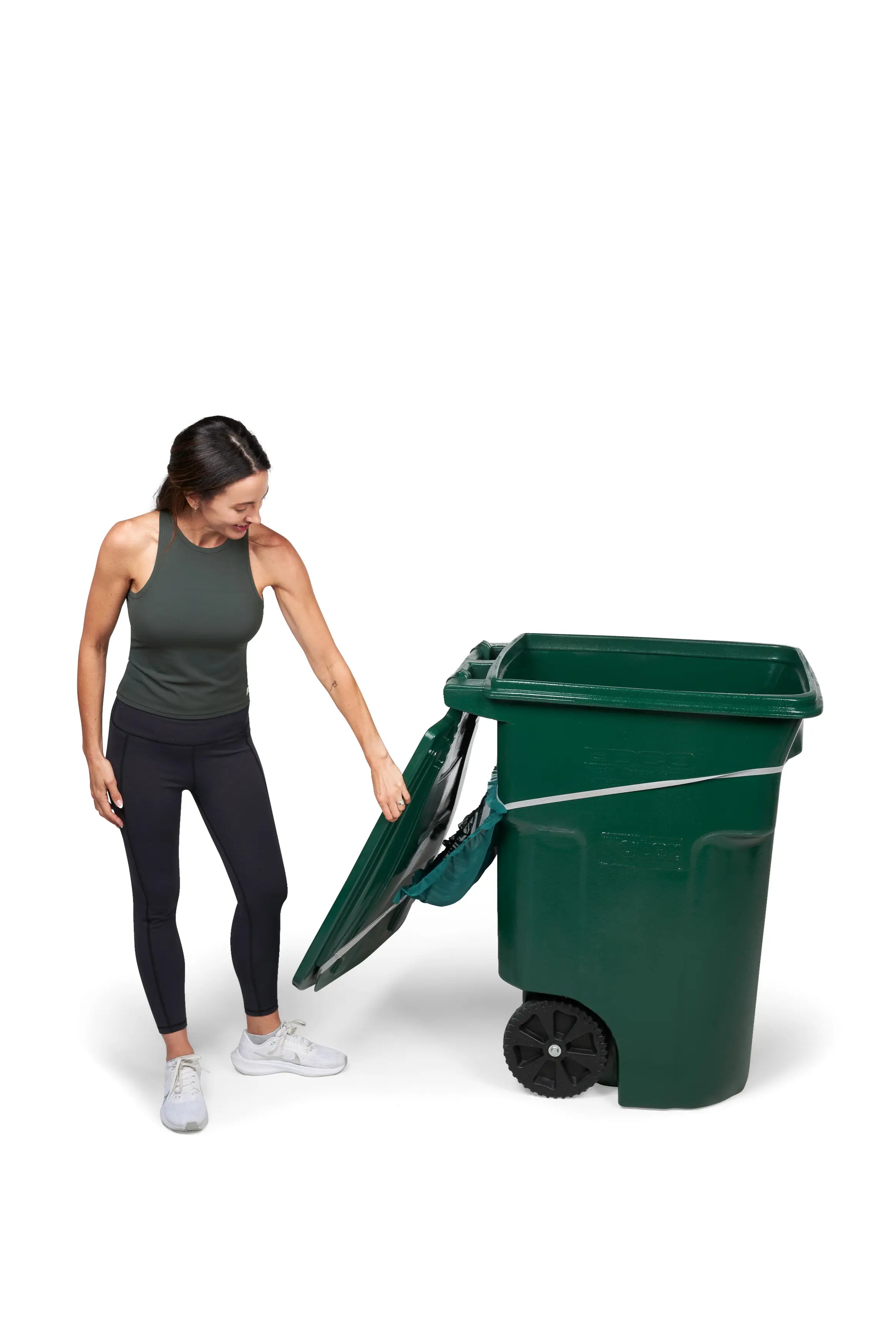 Woman completely flips open her green trash bin cover while Bin Hero remains securely installed.